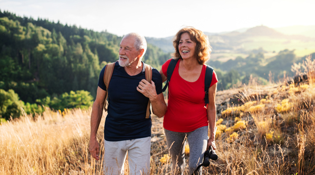 An older couple hiking outdoors